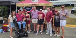 John and Stevie with friends at a college football tailgate.